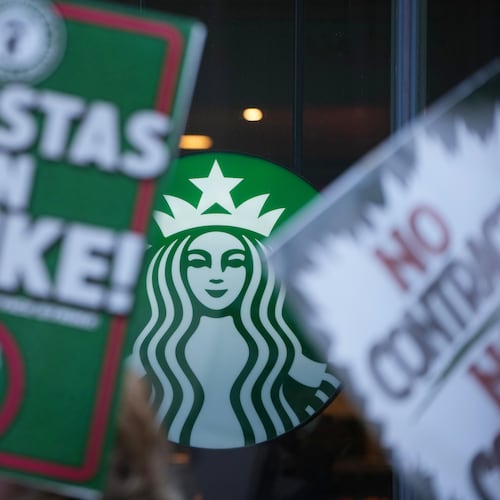 Protesters picket outside a Starbucks, Thursday, Nov. 13, 2025, in Philadelphia. (AP Photo/Matt Slocum)