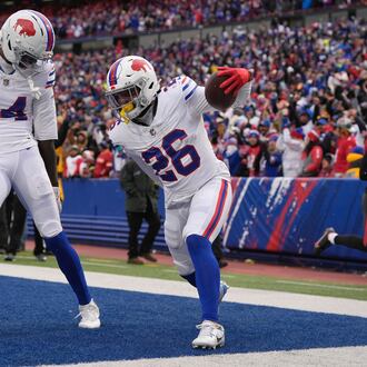 Buffalo Bills running back Ty Johnson (26) celebrates with wide receiver Tyrell Shavers (14) after scoring a touchdown against the Tampa Bay Buccaneers during the first half of an NFL football game, Sunday, Nov. 16, 2025, in Orchard Park, N.Y. (AP Photo/Carolyn Kaster)