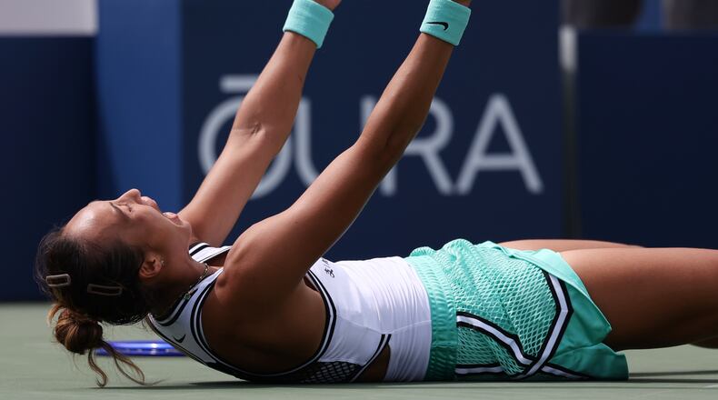 Zheng Qinwen, of China, celebrates after she won her match against Madison Keys, of the United States, during the third round of the U.S. Open tennis championships Saturday, Sept. 5, 2026, in New York. (AP Photo/Heather Khalifa)