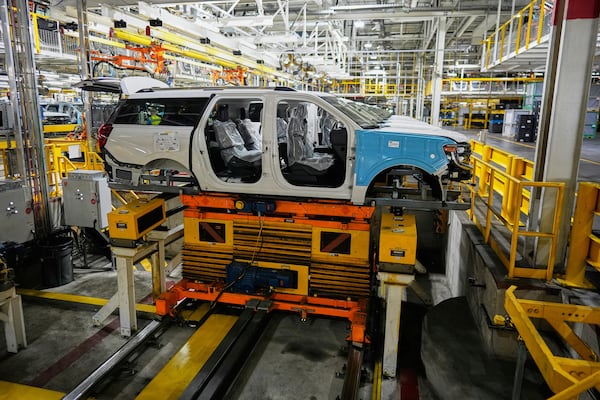 A 2025 Ford Expedition moves on an assembly line during a media tour to launch the 2025 Ford Expedition at the Ford Motor Company Kentucky Truck Plant, Wednesday, April 30, 2025, in Louisville, Ky. (AP Photo/Carolyn Kaster)