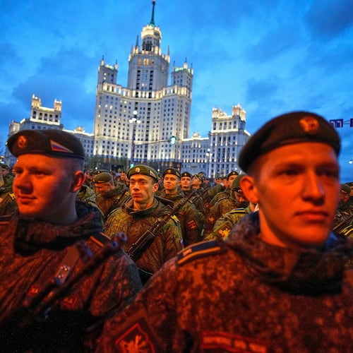 Russian servicemen prepare to march towards Red Square prior to the Victory Day military parade rehearsal in Moscow, Wednesday, April 29, 2026, backdropped by a Stalin stile skyscraper. (AP Photo/Alexander Zemlianichenko)