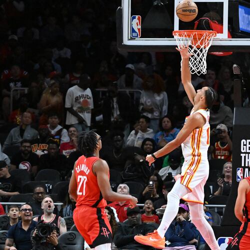 Atlanta Hawks forward Zaccharie Risacher (center) goes to the basket for the shot during the first half in a preseason NBA basketball game at State Farm Arena, Thursday, October 16, 2025, in Atlanta. Houston Rockets won 133-115 over Atlanta Hawks. (Hyosub Shin/AJC)