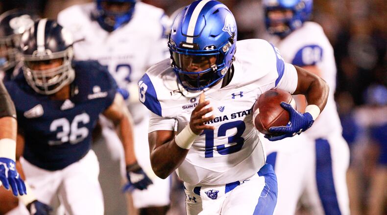 Dan Ellington of the Georgia State Panthers is forced out of the pocket by the Georgia Southern Eagles defense in the second quarter on November 30, 2019 at Allen E. Paulson Stadium in Statesboro, Georgia. (Photo by Chris Thelen/Getty Images)