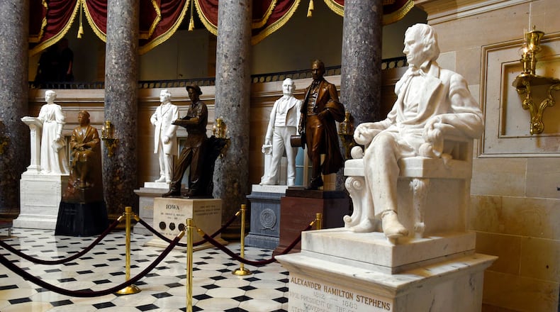 FILE - In this June 24, 2015 file photo, a statue of Alexander Hamilton Stephens, the Confederate vice president throughout the American Civil War, is on display in Statuary Hall on Capitol Hill in Washington. House Minority Leader Nancy Pelosi of Calif is calling for the removal of Confederate statues from the U.S. Capitol as the contentious debate over the appropriateness of such memorials moves to the halls of Congress. (AP Photo/Susan Walsh, File)