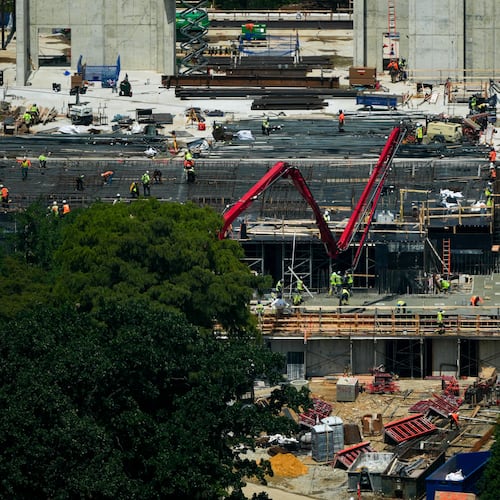 Workers continue construction on the new White House ballroom, as seen from the Washington Monument, Monday, Aug. 17, 2026, in Washington. (AP Photo/Julia Demaree Nikhinson)