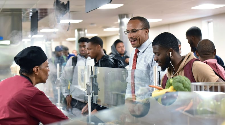 Morehouse College interim president Harold Martin eats with students in the crowded cafeteria on campus on Wednesday, Aug. 30, 2017. A HYOSUB SHIN / HSHIN@AJC.COM