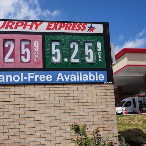 The per-gallon prices for regular unleaded and diesel fuel are displayed on a sign outside a Murphy Express gasoline station, Tuesday, April 28, 2026, in Centennial, Colo. (AP Photo/David Zalubowski)