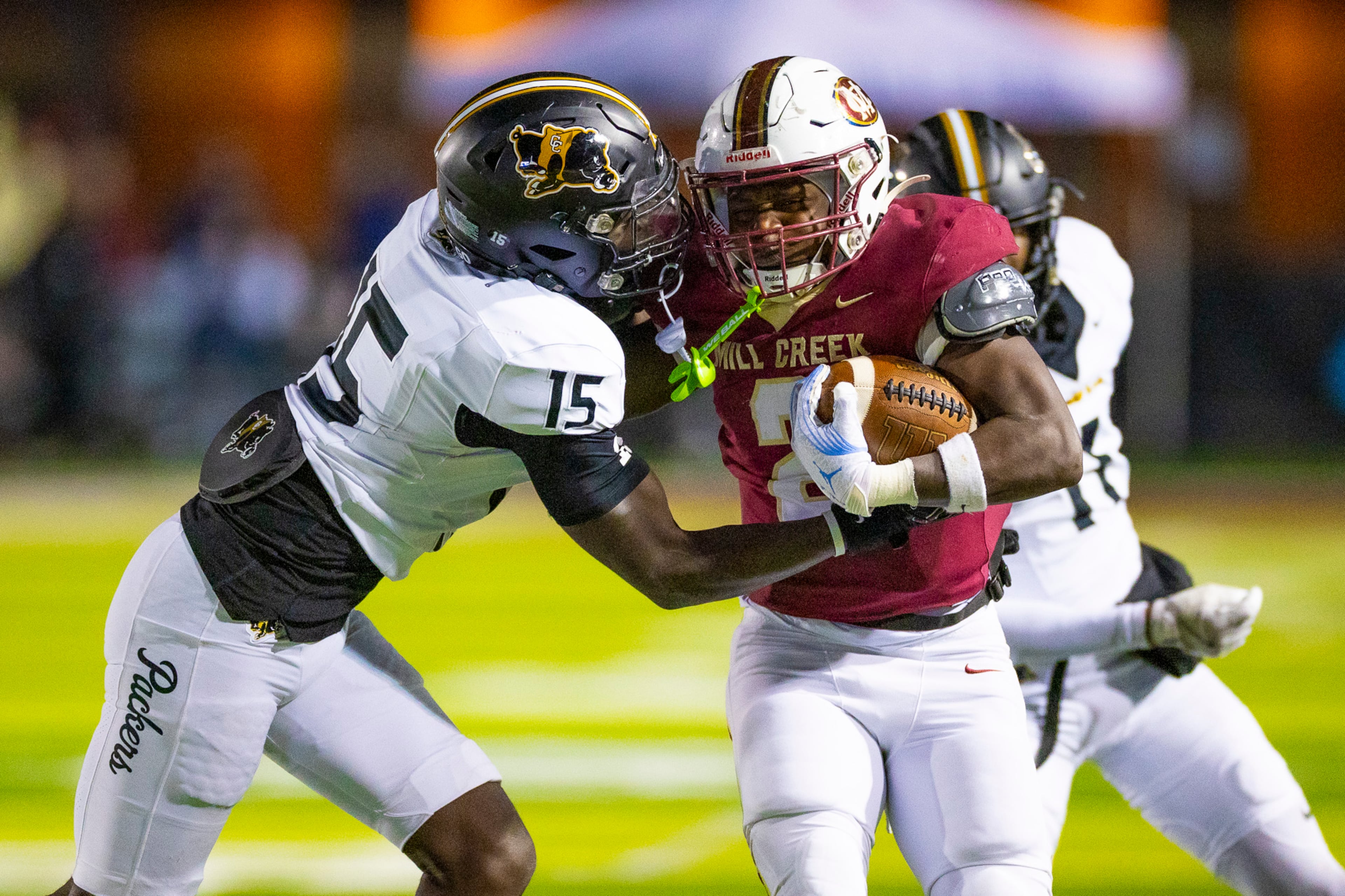 Mill Creek running back Jayde Beasley (2) blocks middle linebacker Davion Enoch (15) during the first half against Colquitt at Mill Creek Community Stadium in Hoschton on Nov. 14th, 2025. (Oscar Guevara Saenz for the AJC)