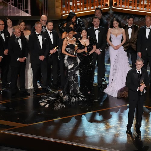 Paul Thomas Anderson, left center, Sara Murphy, right center, and the team from "One Battle After Another" accept the award for best picture during the Oscars on Sunday, March 15, 2026, at the Dolby Theatre in Los Angeles. (AP Photo/Chris Pizzello)