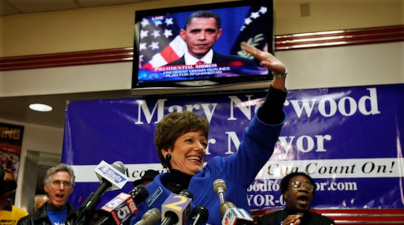 Mary Norwood waves to supporters as she makes an election night appearance at the Varsity in her runoff against Kasim Reed. Norwood lost the runoff to Reed.
