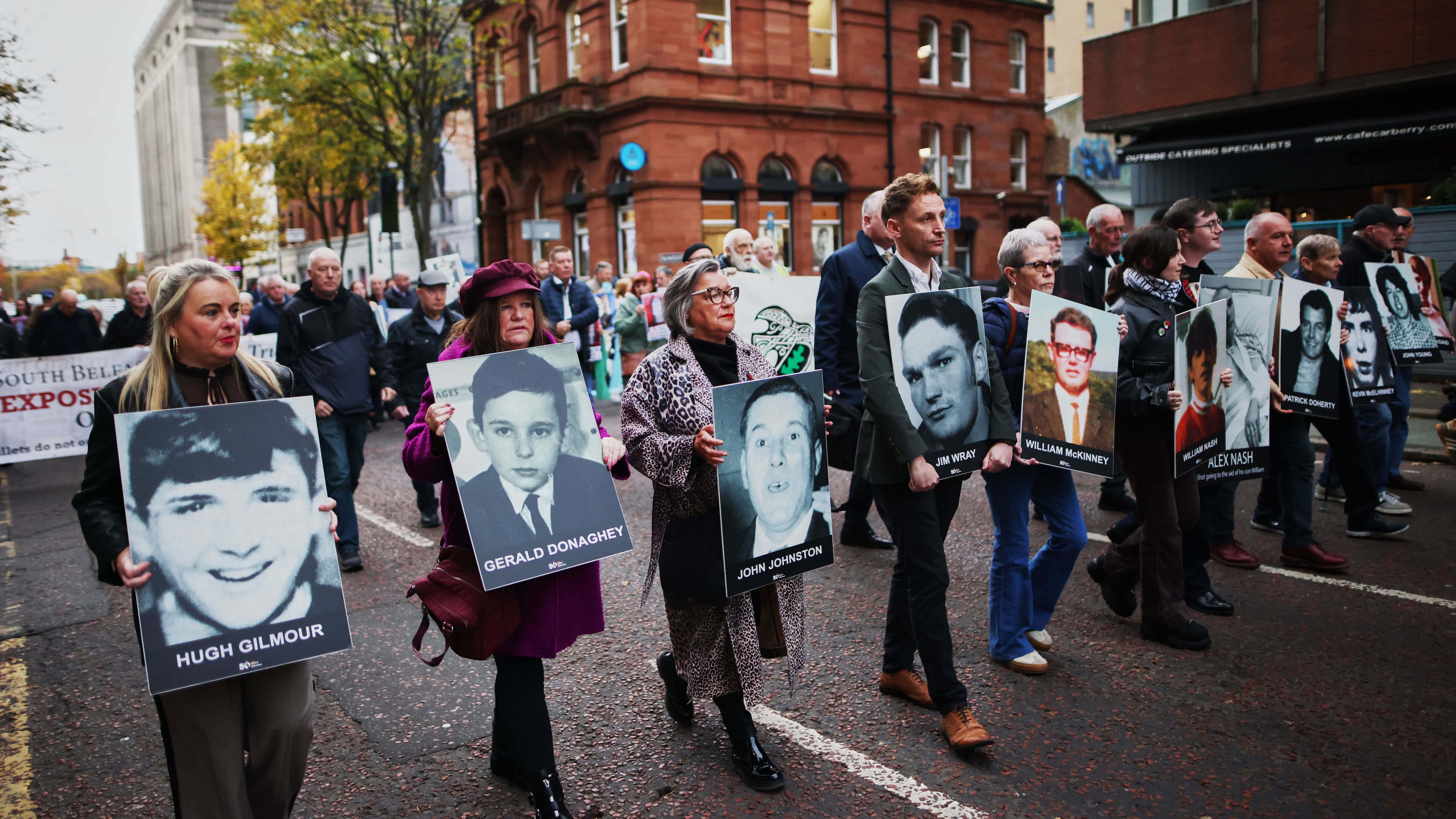 Relatives and supporters of the victims of the 1972 Bloody Sunday massacre march to Belfast Crown Court ahead of the verdict on the trial of a British soldier identified only as Soldier F, Belfast, in Northern Ireland, Thursday, Oct. 23, 2025. (AP Photo/Peter Morrison)
