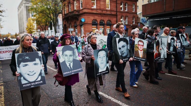 Relatives and supporters of the victims of the 1972 Bloody Sunday massacre march to Belfast Crown Court ahead of the verdict on the trial of a British soldier identified only as Soldier F, Belfast, in Northern Ireland, Thursday, Oct. 23, 2025. (AP Photo/Peter Morrison)