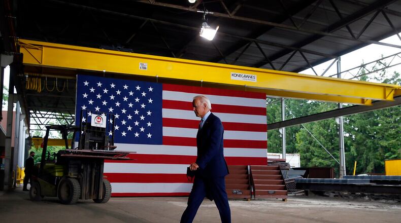 FILE - In this July 9, 2020, file photo Democratic presidential candidate former Vice President Joe Biden walks from the podium after speaking at McGregor Industries in Dunmore, Pa. Biden is pledging to define his presidency by a sweeping economic agenda beyond anything Americans have seen since the Great Depression and the industrial mobilization for World War II. (AP Photo/Matt Slocum, File)