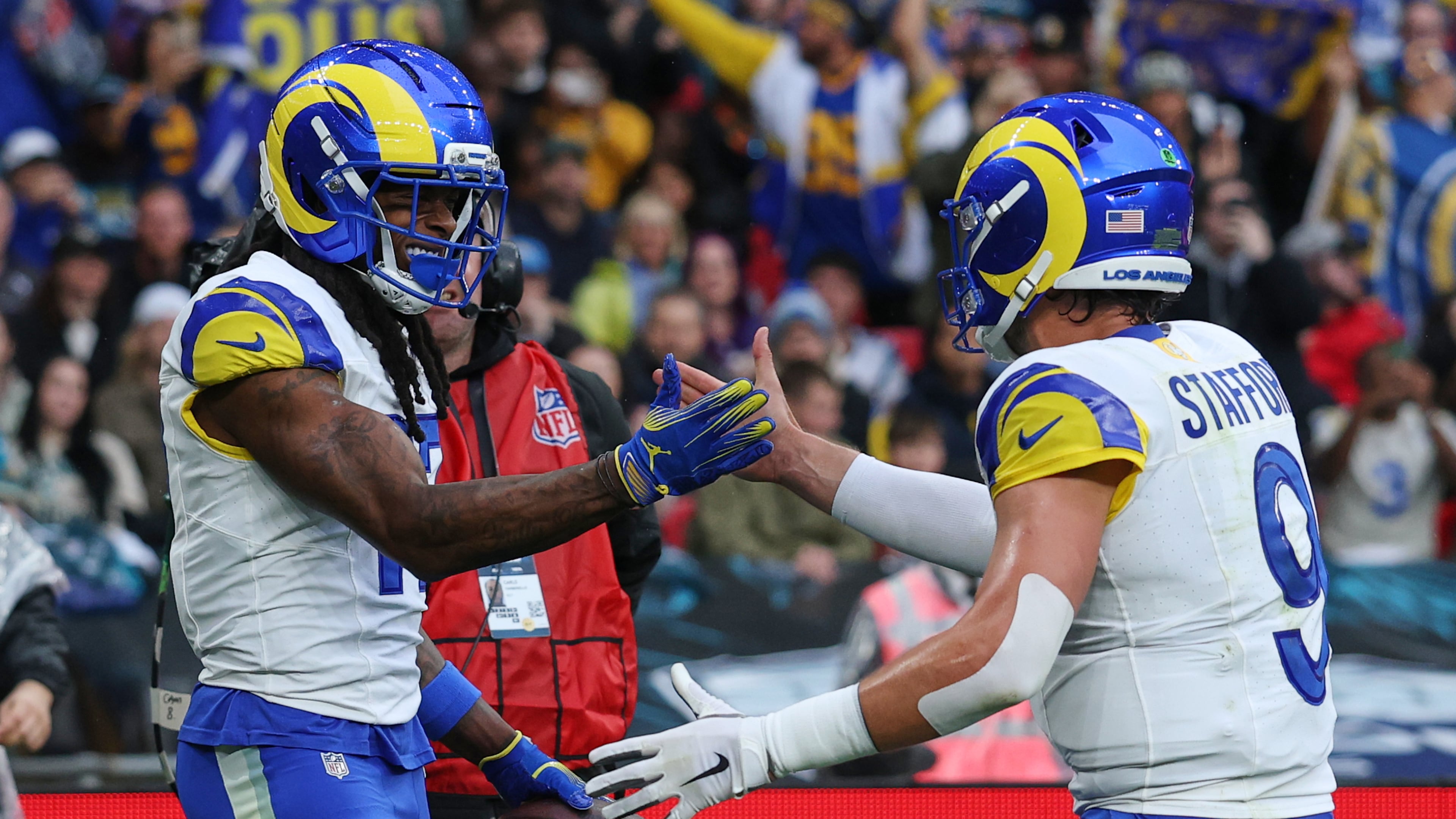 Los Angeles Rams wide receiver Davante Adams (17) celebrates with Los Angeles Rams quarterback Matthew Stafford (9) after scoring a touchdown during the first half of an NFL football game between the Los Angeles Rams and the Jacksonville Jaguars in London, Sunday, Oct. 19, 2025. (AP Photo/Ian Walton)
