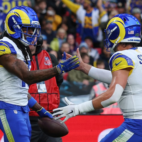 Los Angeles Rams wide receiver Davante Adams (17) celebrates with Los Angeles Rams quarterback Matthew Stafford (9) after scoring a touchdown during the first half of an NFL football game between the Los Angeles Rams and the Jacksonville Jaguars in London, Sunday, Oct. 19, 2025. (AP Photo/Ian Walton)