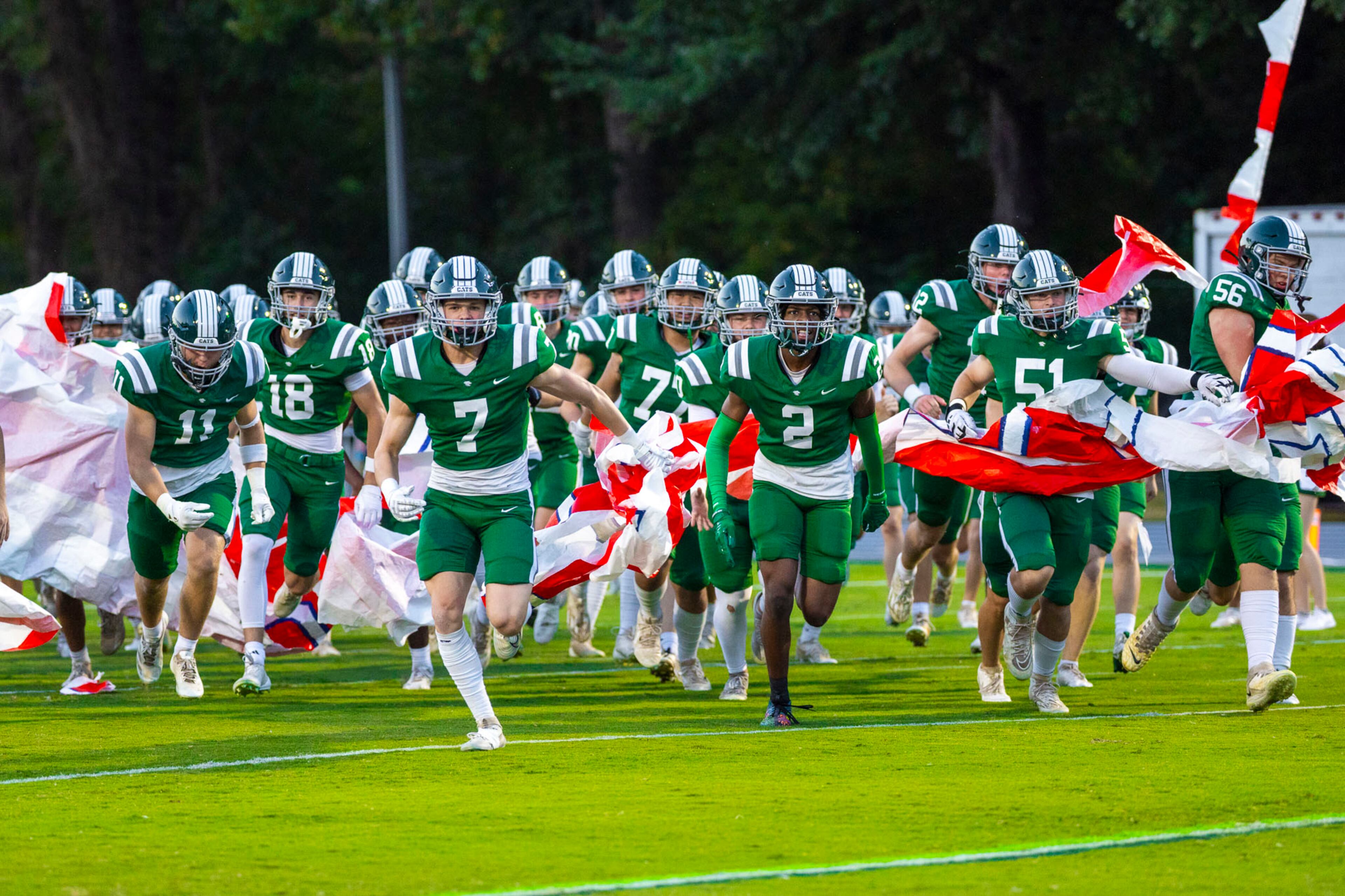 Westminster players run through the banner before a game against Benedictine at Fritz Orr Field in Atlanta, GA on Friday, Sept. 19th, 2025. (Oscar Guevara Saenz for the AJC)
