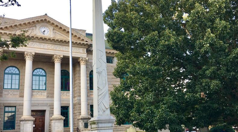 A familiar Decatur sight for generations: children climbing the Confederate monument.