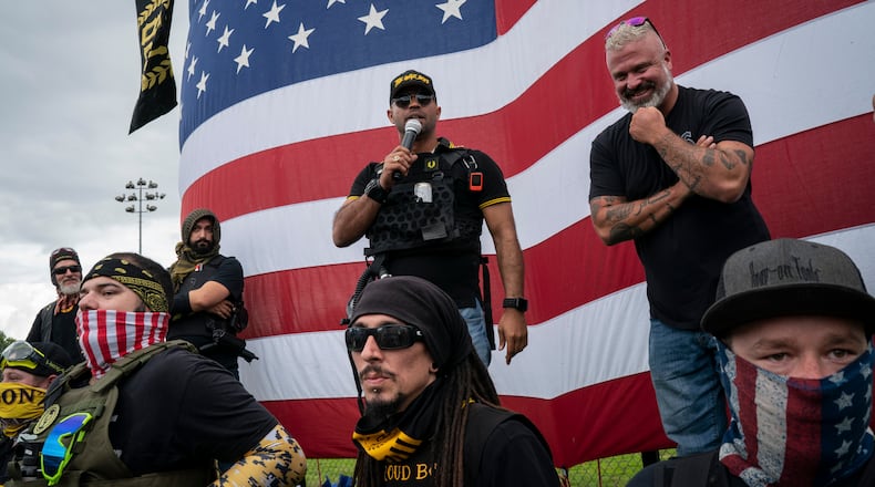 Proud Boys chairman Enrique Tarrio (speaking) and Bevelyn Beatty (not pictured), who once painted over the Black Lives Matter mural outside Trump Tower in the nation's capital, allegedly were stabbed in the incident that took place in the 1400 block of New York Avenue NW and 14th Street, according to NBC News affiliate Washington 4. (Diana Zeyneb Alhindawi/The New York Times)
