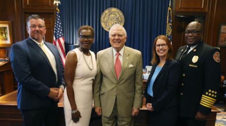 Gov. Nathan Deal (center) held a press conference on June 6 where he awarded a grant of $1.5 million to the city of Fairburn for a roadway project. CONTRIBUTED