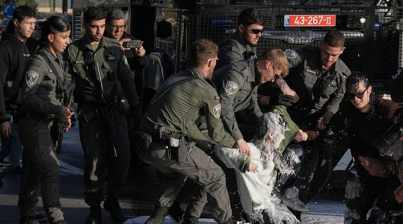 Police disperse demonstrators during a protest against the decision by Israel's parliament to approve the death penalty for Palestinians convicted of murdering Israelis, in Jerusalem Tuesday, March 31, 2026. (AP Photo/Mahmoud Illean)