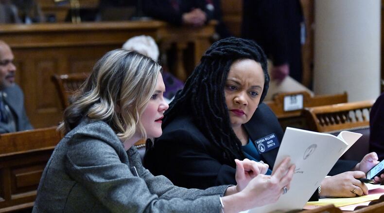 State Sen. Elena Parent (left) and Sen. Nikema Williams confer during the morning session of the ninth day of the 2020 General Assembly at the Georgia State Capitol in Atlanta on Friday, January 31, 2020. (Hyosub Shin / Hyosub.Shin@ajc.com)
