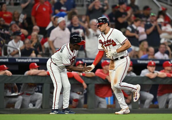 Atlanta Braves' first baseman Matt Olson (28) celebrates with Atlanta Braves' third base coach Ron Washington (37) after hitting a solo home run during the fifth inning at Truist Park, Thursday, September 7, 2023, in Atlanta. Atlanta Braves won 8-5 over St. Louis Cardinals. (Hyosub Shin / Hyosub.Shin@ajc.com)
