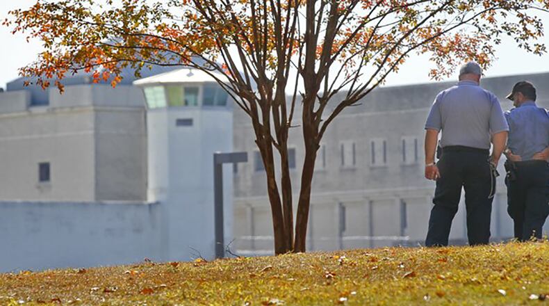 Prison officials survey a portion of the Atlanta Federal Penitentiary. (AJC file, 2011, John Spink)