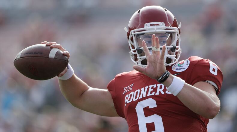 Oklahoma quarterback Baker Mayfield passes during warmups before the Rose Bowl NCAA college football game against Georgia, Monday, Jan. 1, 2018, in Pasadena, Calif. (AP Photo/Gregory Bull)