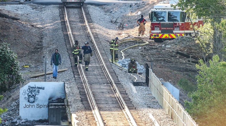Crews extinguished a fire under a train trestle off Cheshire Bridge Road and Wellbourne Drive.