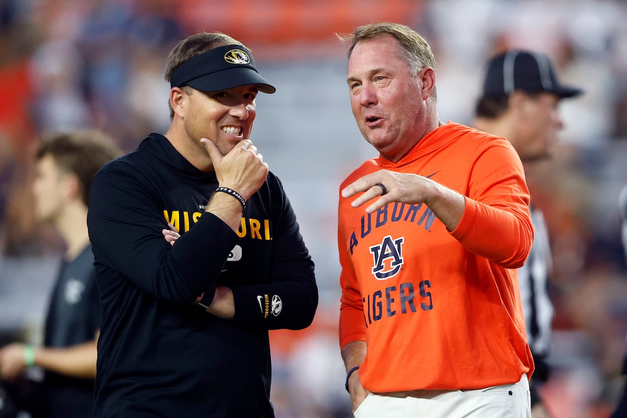 Missouri head coach Eli Drinkwitz (left) talks with Auburn head coach Hugh Freeze (right) before an NCAA college football game, Saturday, Oct. 18, 2025, in Auburn, Ala. (Butch Dill/AP)