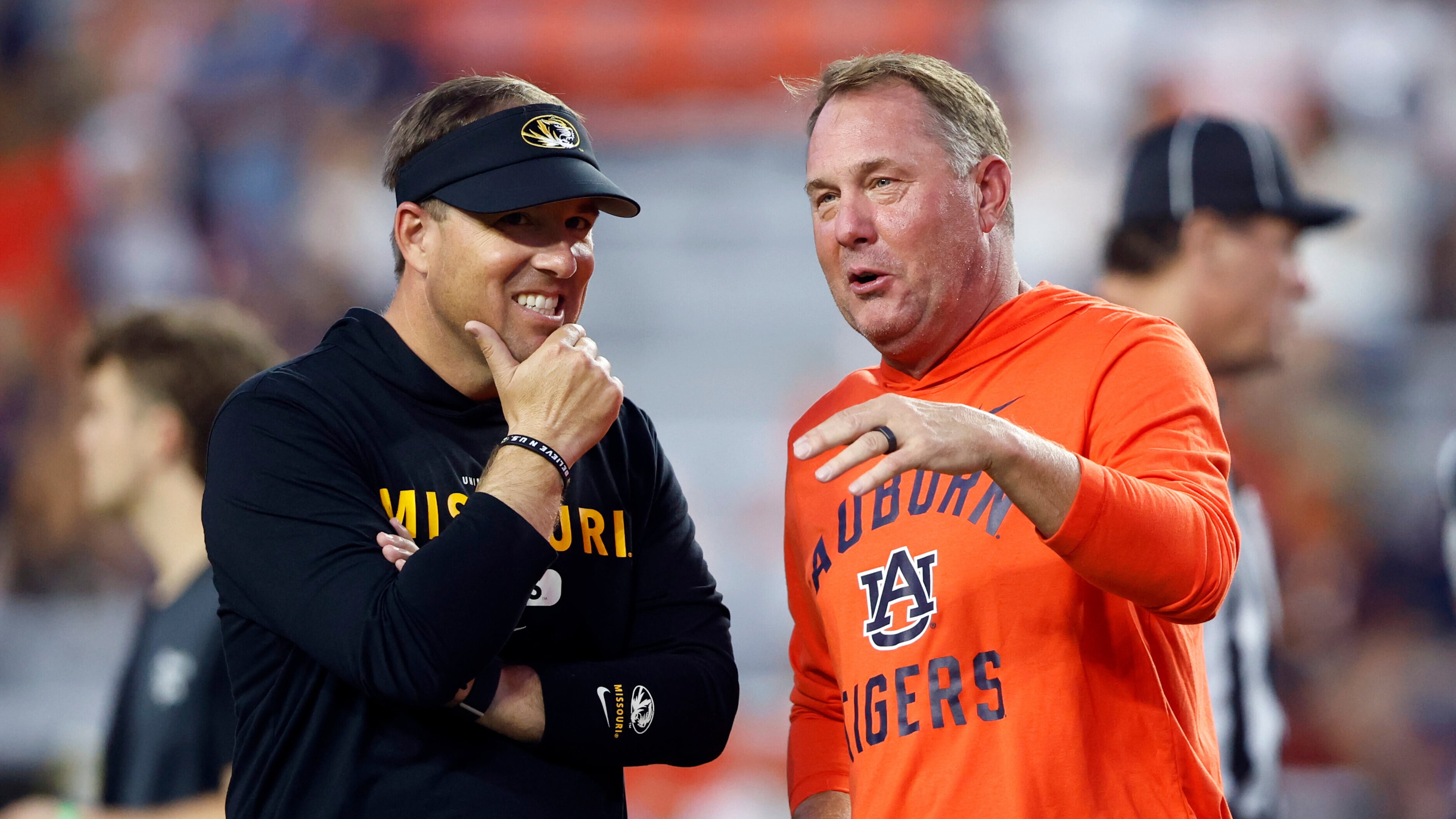 Missouri head coach Eli Drinkwitz (left) talks with Auburn head coach Hugh Freeze (right) before an NCAA college football game, Saturday, Oct. 18, 2025, in Auburn, Ala. (Butch Dill/AP)