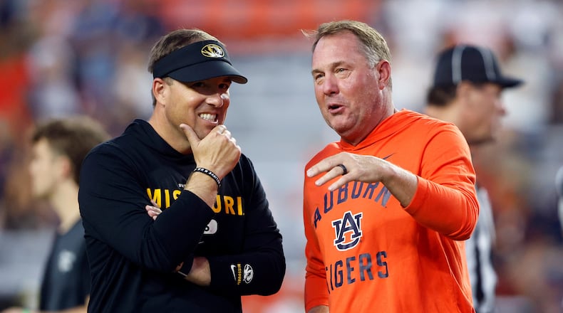 Missouri head coach Eli Drinkwitz (left) talks with Auburn head coach Hugh Freeze (right) before an NCAA college football game, Saturday, Oct. 18, 2025, in Auburn, Ala. (Butch Dill/AP)
