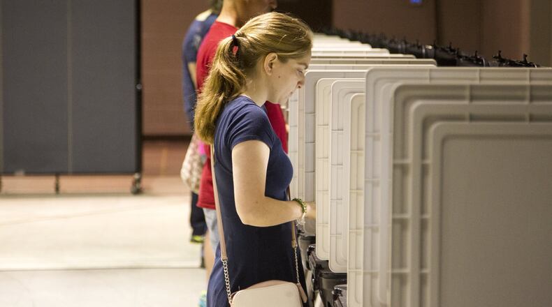 Cobb County residents take part in the primary election voting at Noonday Baptist Church in Marietta, Georgia, on Tuesday, May 22, 2018. (REANN HUBER/REANN.HUBER@AJC.COM)