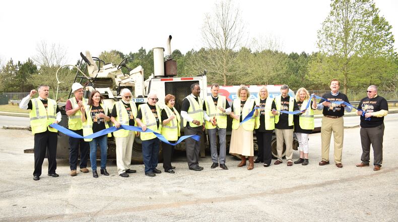 City and county officials attended a ribbon-cutting for the new round of road work.