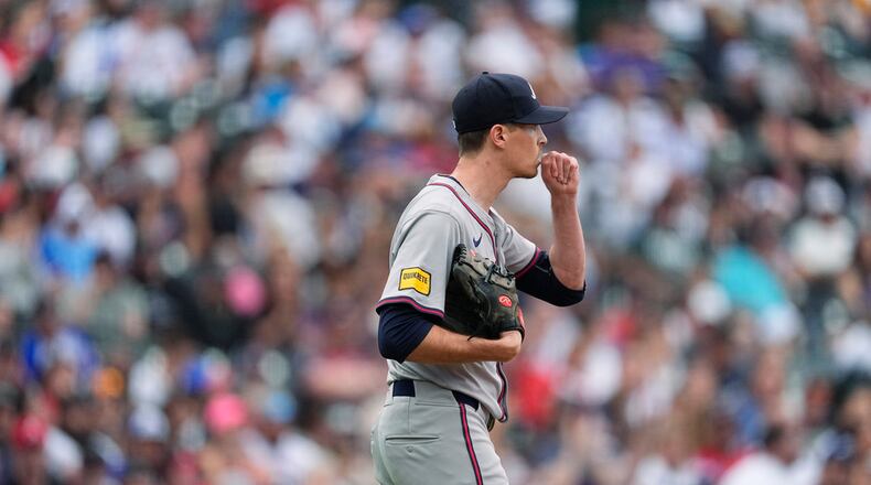Atlanta Braves starting pitcher Max Fried reacts after giving up a three-run home run to Colorado Rockies' Sam Hilliard in the second inning of a baseball game Saturday, Aug. 10, 2024, in Denver. (AP Photo/David Zalubowski)