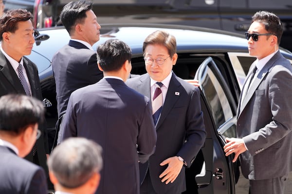 Newly elected South Korean President Lee Jae-myung, center right, arrives for the Presidential Inauguration at the National Assembly in Seoul, South Korea, Wednesday, June 4, 2025. (AP Photo/Lee Jin-man, Pool)