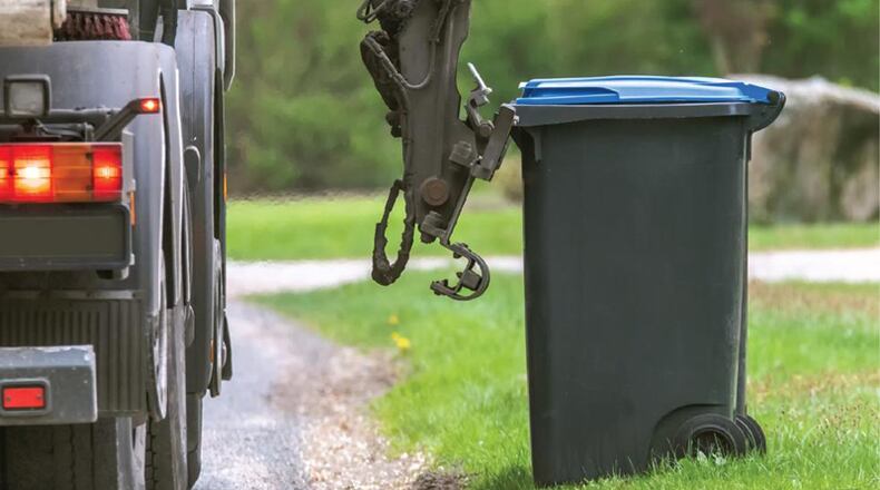 Waste Management announced it is postponing non-essential services, such as bulk collections and yard waste pickups, until the COVID-19 crisis has passed. AJC FILE