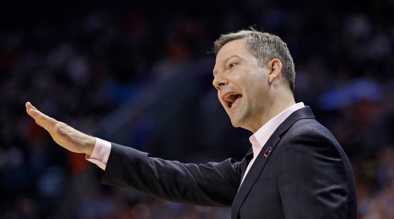 UMBC head coach Ryan Odom gestures during the first half of the team's first-round game against UMBC in the NCAA men's college basketball tournament in Charlotte, N.C., Friday, March 16, 2018. (AP Photo/Gerry Broome)