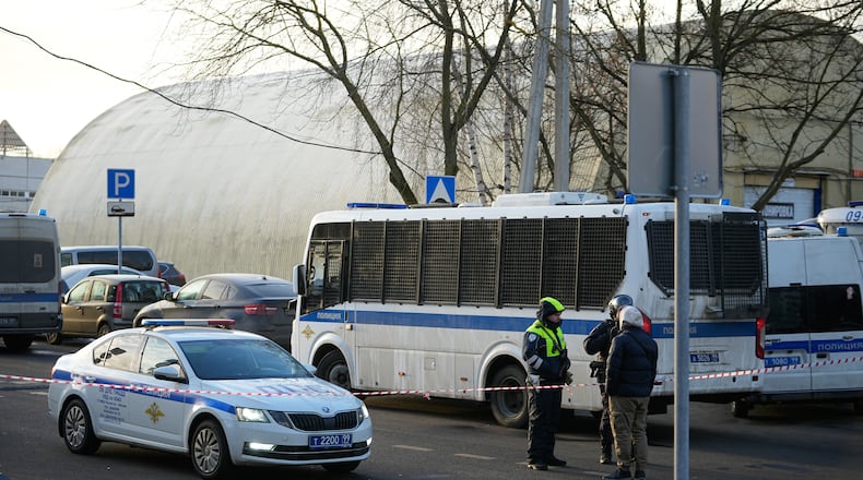 Police block the road near the scene of a deadly explosion in Moscow, Wednesday, Dec. 24, 2025. (AP Photo/Pavel Bednyakov)