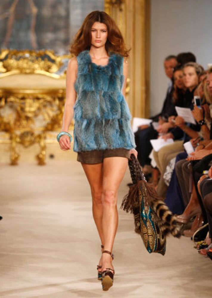 Models take the catwalk during Milan Fashion Week 2011