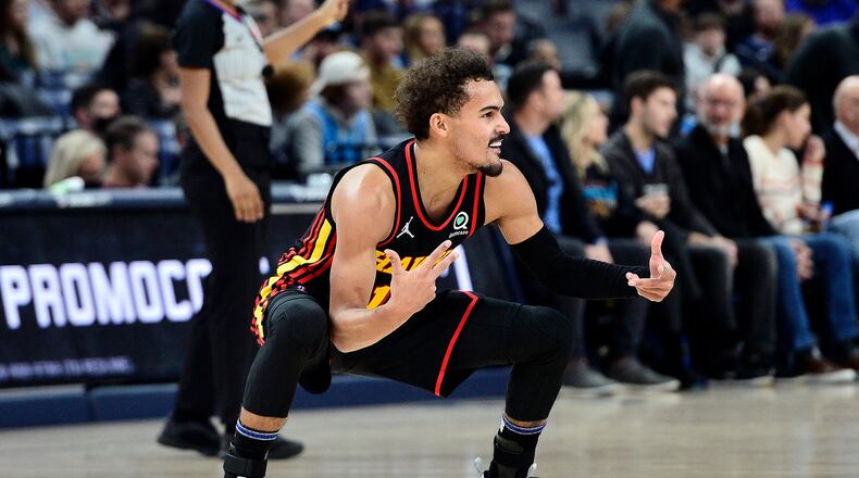 Atlanta Hawks guard Trae Young (11) reacts in the second half of an NBA basketball game against the Memphis Grizzlies, Friday, Nov. 26, 2021, in Memphis, Tenn. (AP Photo/Brandon Dill)