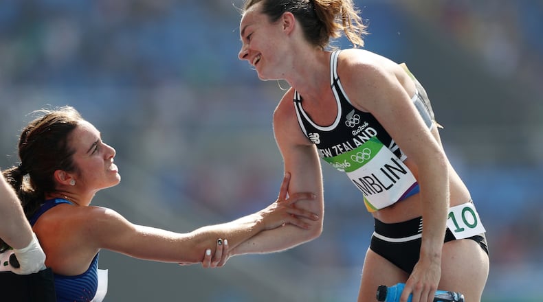 RIO DE JANEIRO, BRAZIL - AUGUST 16: Abbey D'Agostino of the United States (L) talks with Nikki Hamblin of New Zealand after the Women's 5000m Round 1 - Heat 2 on Day 11 of the Rio 2016 Olympic Games at the Olympic Stadium on August 16, 2016 in Rio de Janeiro, Brazil. (Photo by Patrick Smith/Getty Images)