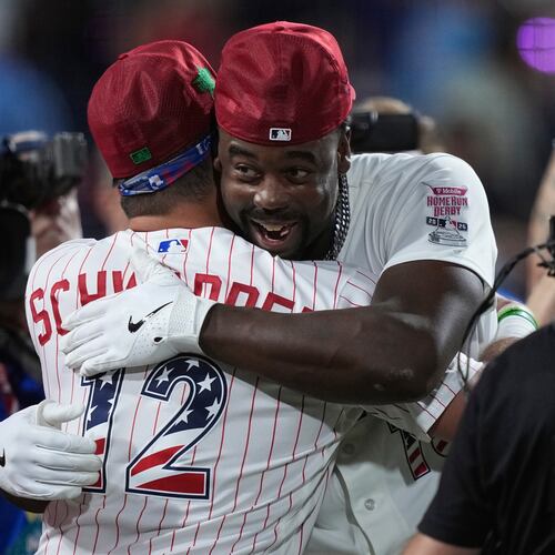 St. Louis Cardinals' Jordan Walker embraces Philadelphia Phillies' Kyle Schwarber after Walker won the MLB baseball All-Star Home Run Derby, Monday, July 13, 2026, in Philadelphia. (AP Photo/Matt Slocum)