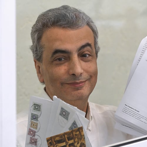 Lev Shlosberg senior member of the Yabloko party, stands in the defendant's box prior to a verdict in the case against him is delivered, in a court in Pskov, Russia, Monday, Aug. 17, 2026. (AP Photo)