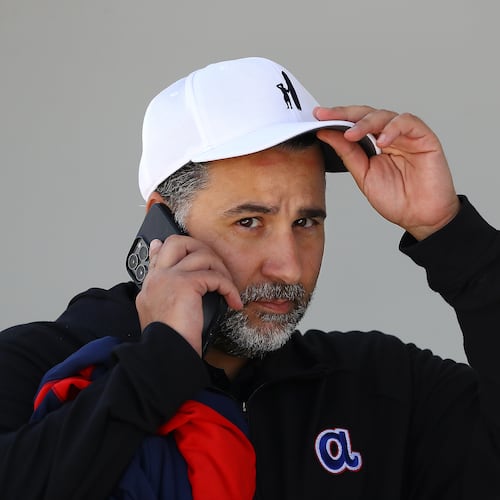 Braves general manager Alex Anthopoulos takes a phone call during the first day of team practice at spring training on Monday, March 14, 2022, in North Port.   “Curtis Compton / Curtis.Compton@ajc.com”