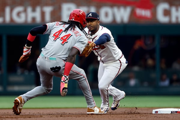 Atlanta Braves second baseman Ozzie Albies (1) tags Cincinnati Reds' Elly De La Cruz (44) out after he slid past the base during the first inning of a baseball game, Wednesday, May 7, 2025, in Atlanta. (AP Photo/Butch Dill)