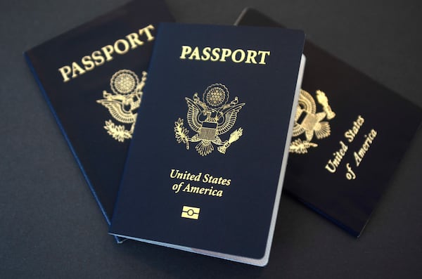 In this May 9, 2017, file photo, U.S. passports lie on a table in Dallas. (AP Photo/Benny Snyder, File)