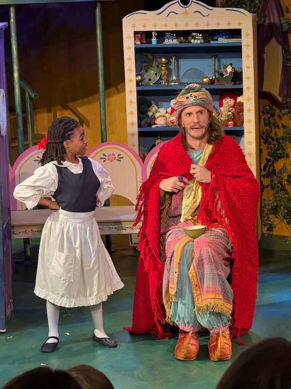 Madeline, played by 10-year-old Anari Vasser from DeKalb Arts Academy, meets Monsieur Brun/Harsha, a genie played by Conner Kocks on opening night of "Madeline's Christmas." Danielle Charbonneau/AJC