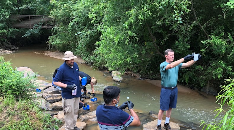Volunteers with Gwinnett Clean & Beautiful monitor chemicals and bacteria in local streams. (Courtesy Gwinnett Clean & Beautiful)