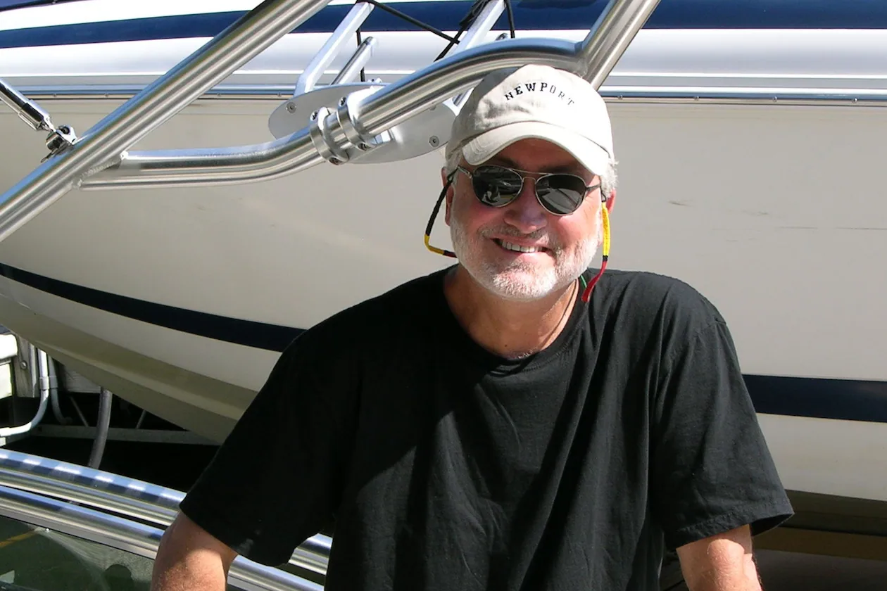 Longtime radio producer and advertising executive John Lambis, who died Dec. 26 at age 76 after a brief illness, loved sailing and owned sailboats, his family said. (Courtesy of Kristina Sullivan)